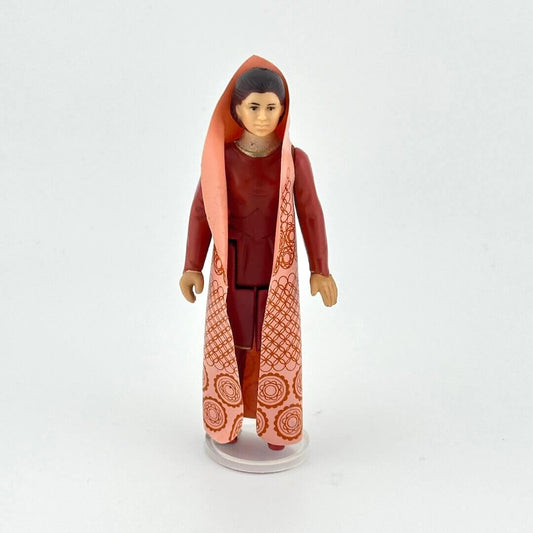 Leia action figure in brown outfit with patterned robe against white background. 