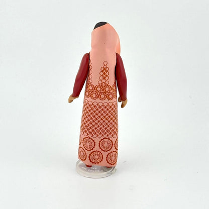 Leia action figure in brown outfit with patterned robe against white background. 