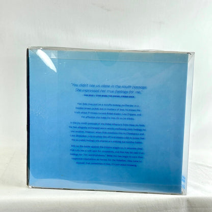 A square blue printed box or package photographed on a white studio background.