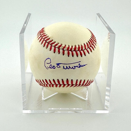 Signed baseball in clear display cube against white background. 