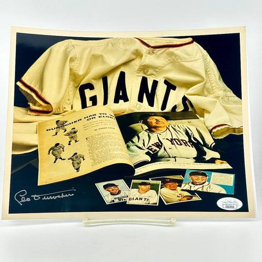 Photograph of memorabilia collage featuring signature of player, JSA authentication sticker in corner. 