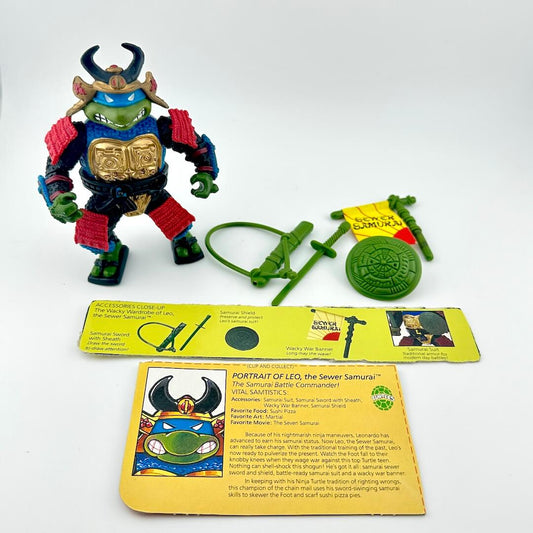 TMNT action figure with card back and accessories against white background. 