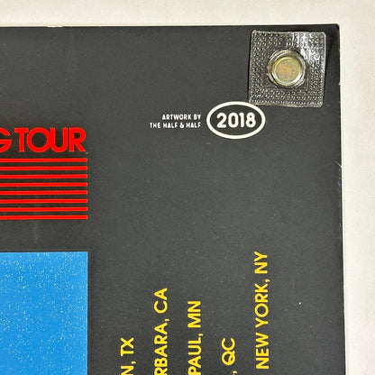 Black album cover with red text, yellow text, and a silver label on a white background