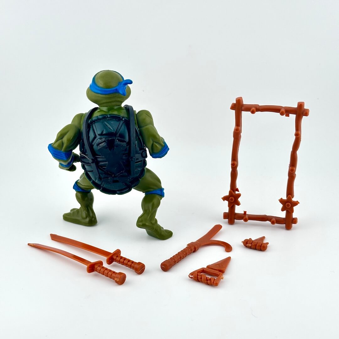 Teenage Mutant Ninja Turtle with accessories on white background. 