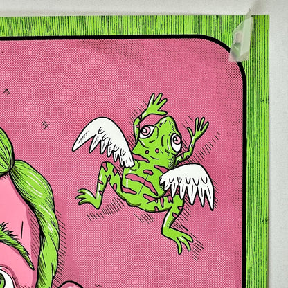 Upper right corner with green and pink design. Green frog with white wings. 