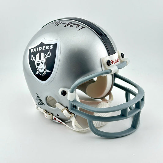 Oakland Raiders mini football helmet on a white background