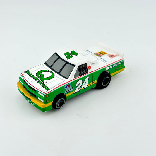 Model race car with green and white colors on a light gray background