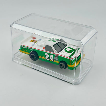 Model car with 'Quaker State' branding in a clear display case on a light gray background