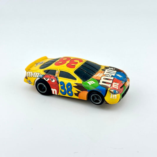 Colorful toy race car with M&M's branding on a white background