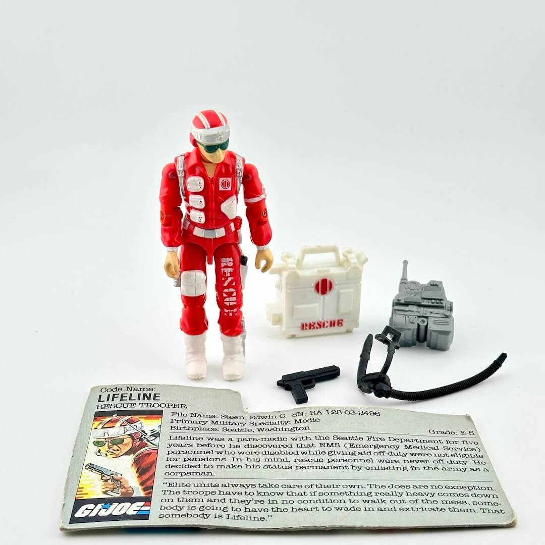 Toy figure in red uniform with accessories on a white background