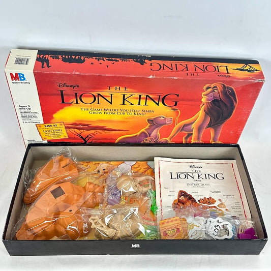 Vintage 'The Lion King' board game box with game pieces and instructions on a white background