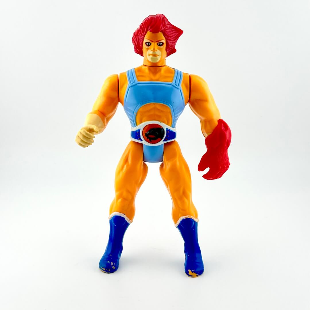 Thundercats action figure of Lion-O with red glove against white background. 