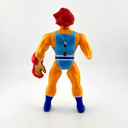 Action figure with red hair, blue top, orange pants, and blue shoes on a white background