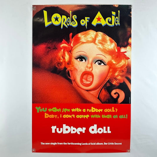 Vintage-style album cover with a woman's face and text, featuring the title 'Lords of Acid' and 'Rubber Doll'.