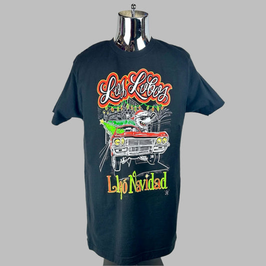 Black short sleeve t-shirt with santa hat wearing fink driving muscle car down LA street. 