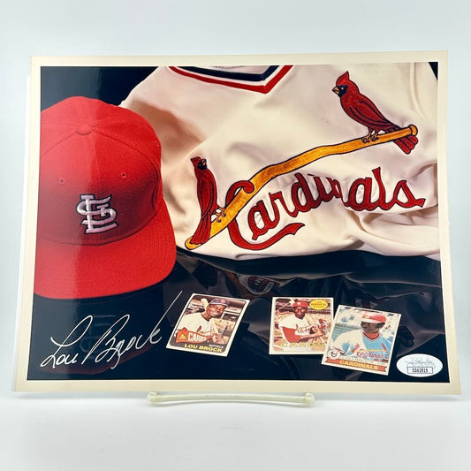 Photograph of memorabilia collage featuring signature of player, JSA authentication sticker in corner. 