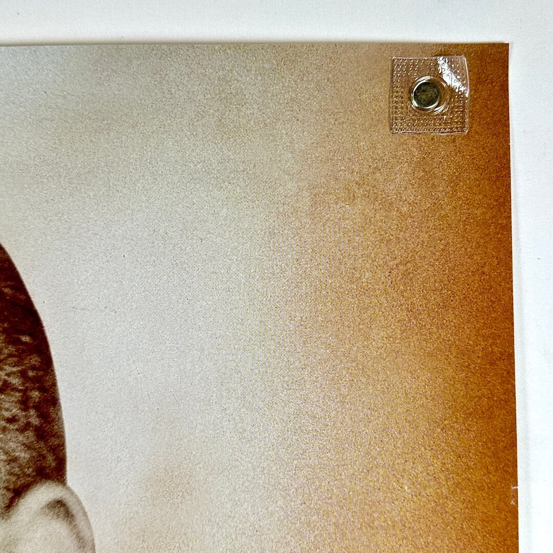 Top right corner of poster with no damage.