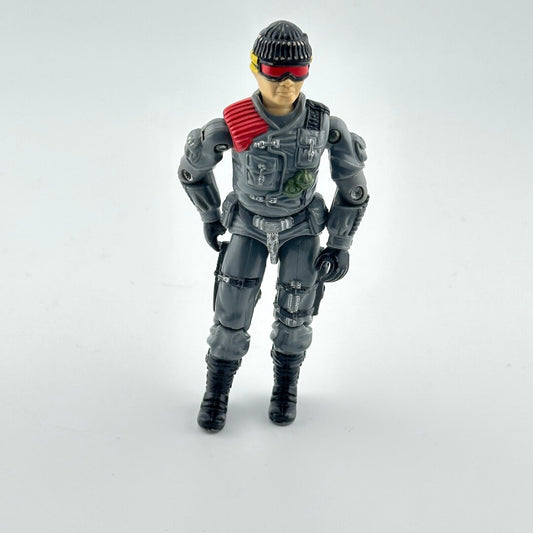 Toy figure in a futuristic gray suit with red accents on a white background