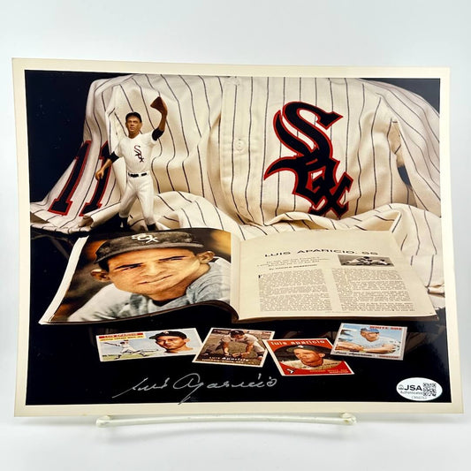 Baseball memorabilia display with a jersey, photos, and cards featuring a player's signature.