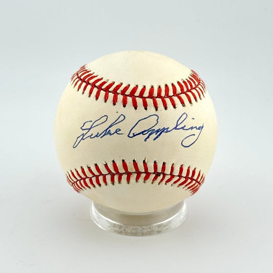 Baseball with autograph on a white background