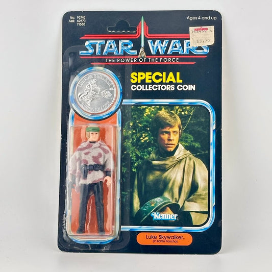Star Wars action figure with coin in packaging on a white background