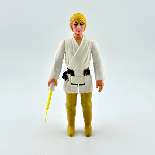 Vintage action figure of a character from a science fiction franchise on a white background