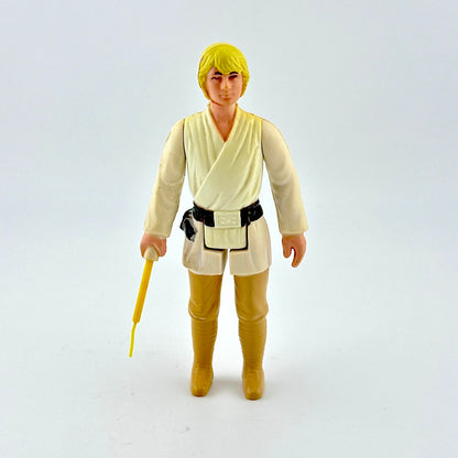 Action figure in a beige outfit with a yellow lightsaber on a white background