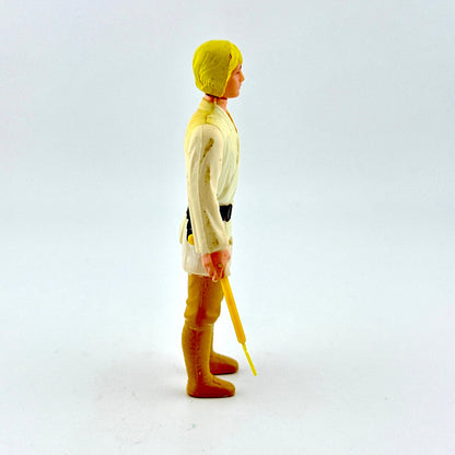 Toy figure in a yellow raincoat and boots holding a yellow umbrella on a white background