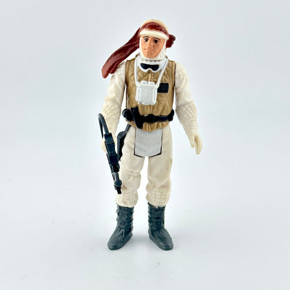 Action figure in a beige and white outfit with a helmet on a white background