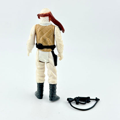 Action figure in desert outfit with weapon on a white background