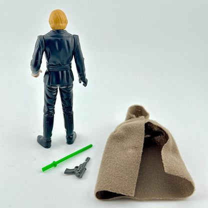 Action figure with a cape and accessories on a white background