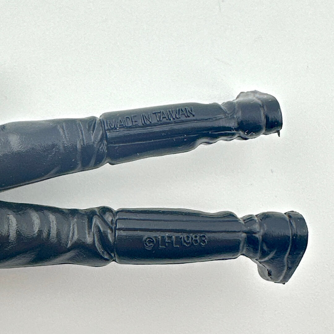 Close-up of back of figure's legs with 'Made in Taiwan' and 'LFL 1983' branding on a light gray background.