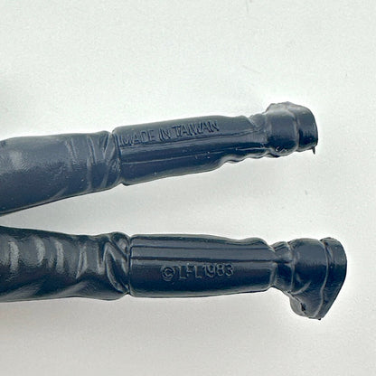 Close-up of back of figure's legs with 'Made in Taiwan' and 'LFL 1983' branding on a light gray background.