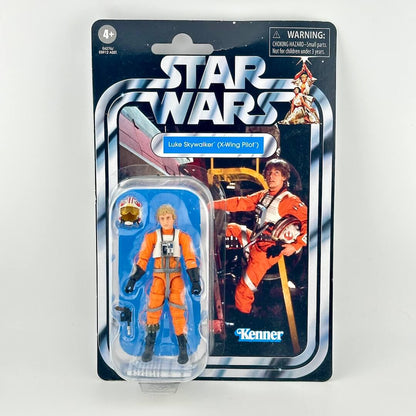 A Star Wars Kenner action figure of Luke Skywalker in his 'X-Wing Pilot' outfit, still in its original blister card packaging.