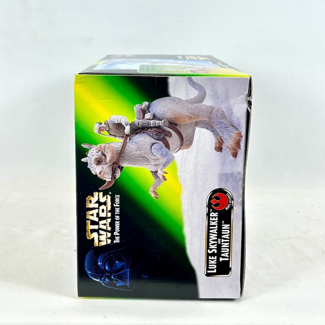 Star Wars toy figure packaging with Tauntaun and Luke Skywalker on a white background