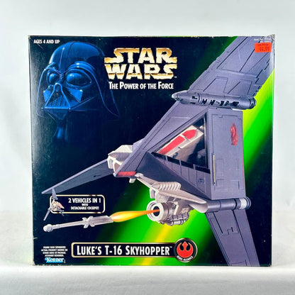 Star Wars toy spaceship packaging featuring image of ship firing missile with green background. 