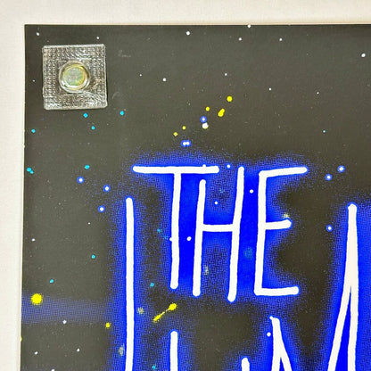 Top left corner of poster with crisp corner and clean edges. 