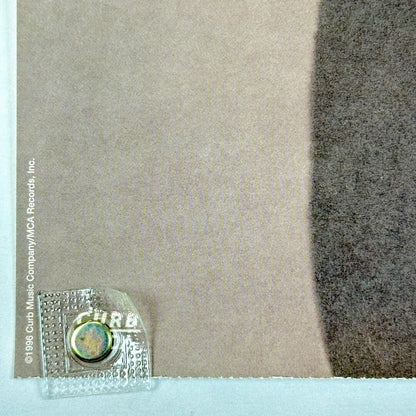 Bottom left corner with licensing information and perforated edge. 