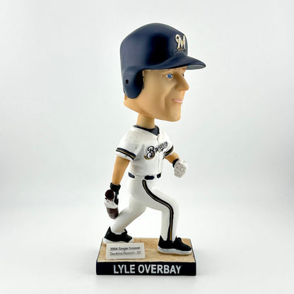 Bobblehead of a baseball player in uniform with a helmet on a white background