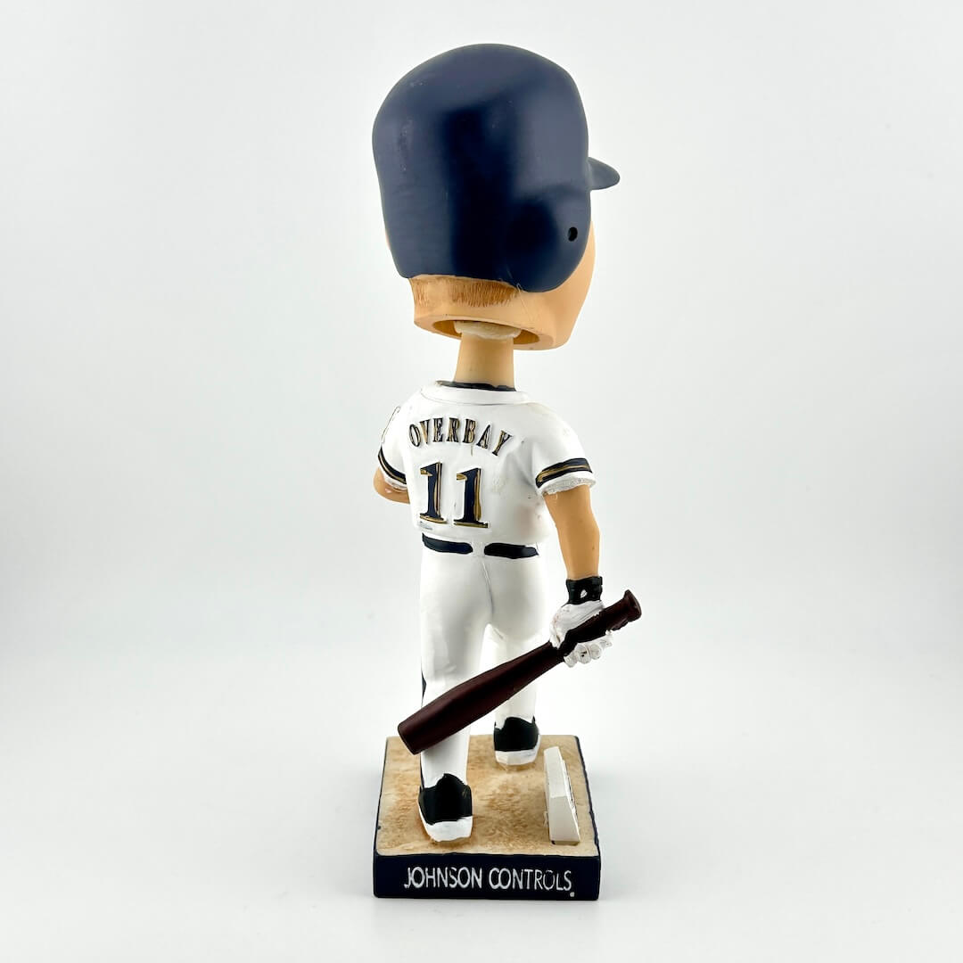 Baseball bobblehead figure with a uniform and bat on a white background
