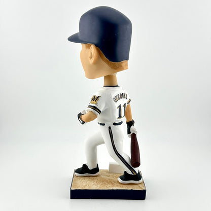 Baseball bobblehead figure in a white uniform with a dark blue helmet on a white background