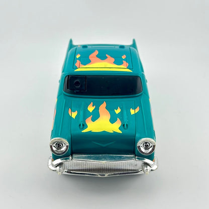 A teal toy car with yellow and orange flame decals on the hood and roof, photographed from the front.
