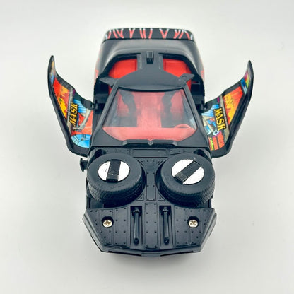 Front view of black vehicle with open wing doors and orange interior. 