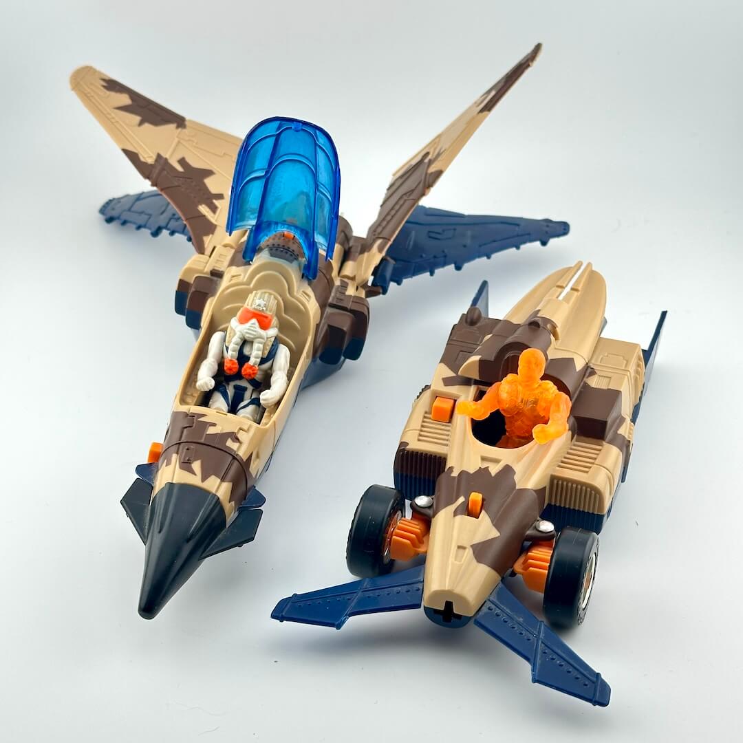 Two toy vehicles on a light gray background with open cockpits to show pilots. 
