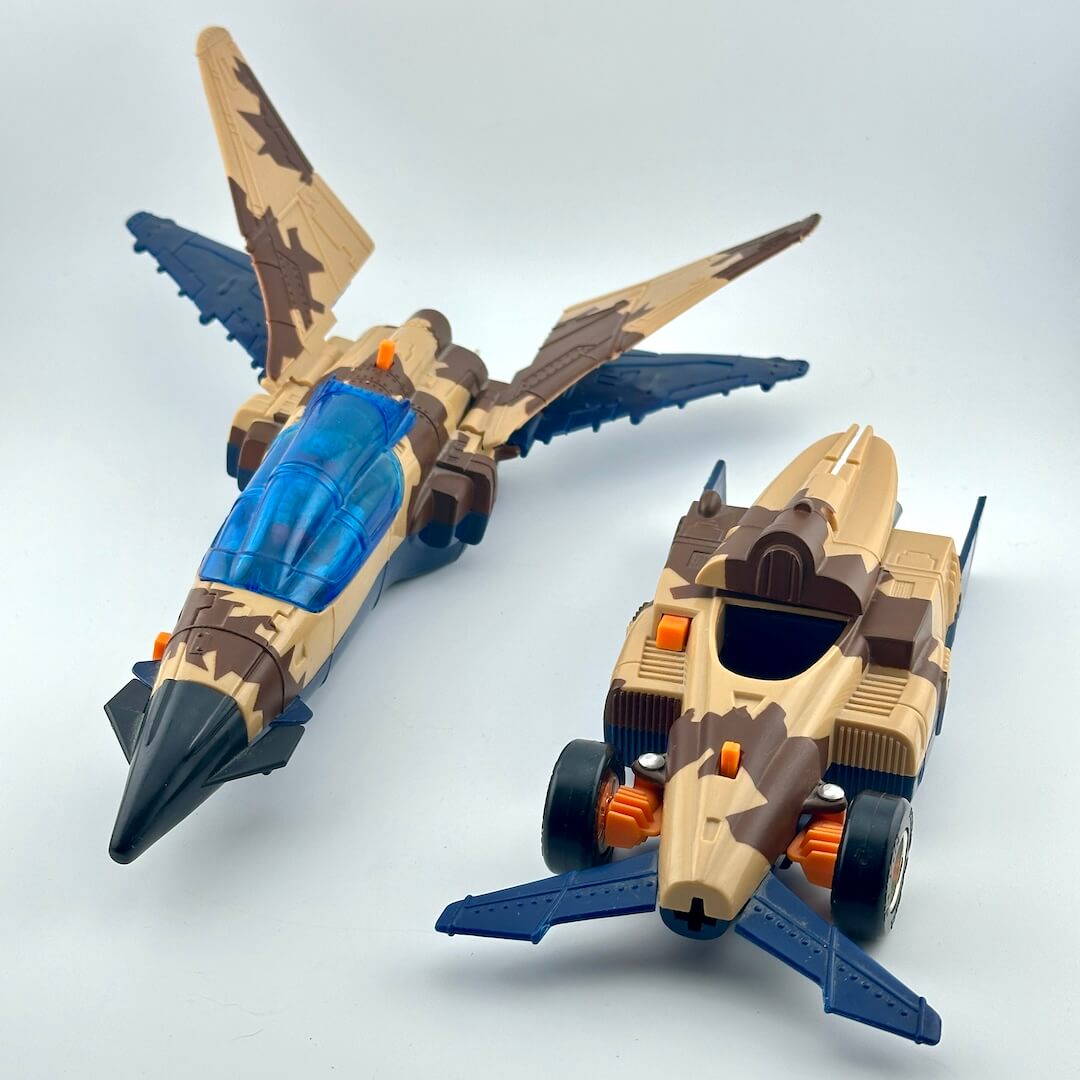 Two toy vehicles, a fighter jet and a car, both featuring a desert camouflage pattern in tan, brown, and black.