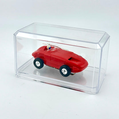 Red toy car inside a clear acrylic display case on a white background