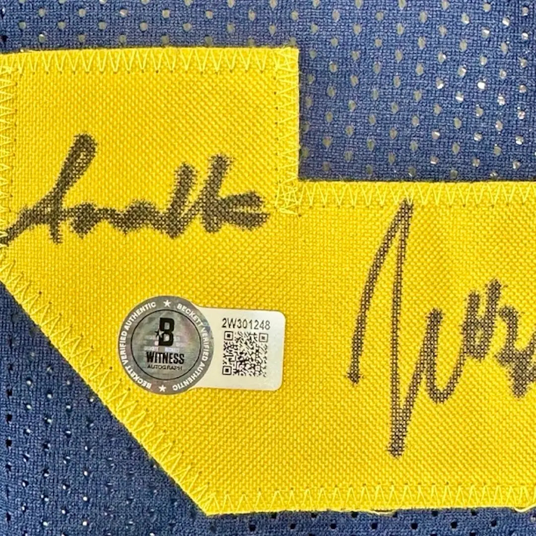 Close up of Beckett Witness Authentication holo sticker in 3 in yellow 23 stitched on reverse of jersey.