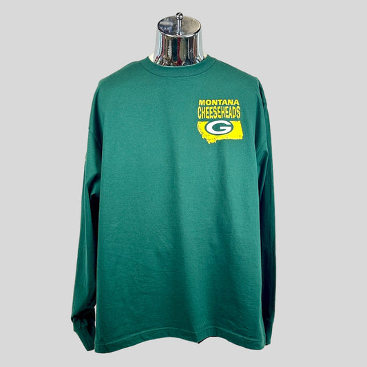 Green long-sleeve shirt with 'Montana Cheeseheads' logo on a mannequin against a white background