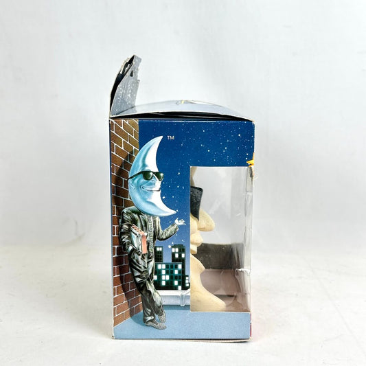 Boxed product with a character holding a moon-like object on a white background