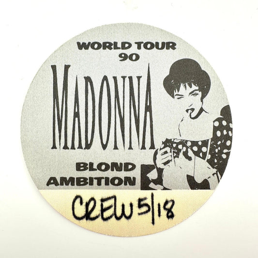 Round sticker with Madonna's name and 'Blond Ambition' tour details on a white background